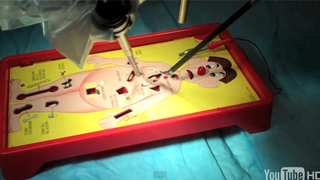 Watch This Robot Surgeon Play Operation (The Game) as Easily as It Can Sew Up Your Colon